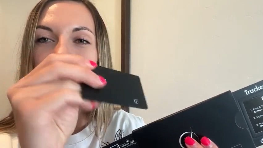 Customer showing the slim profile of the Vantamo tracker card