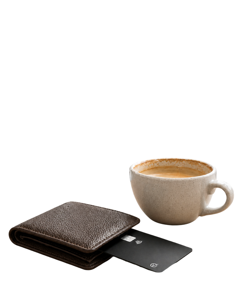 Vantamo tracker card at rest beside a wallet and coffee cup