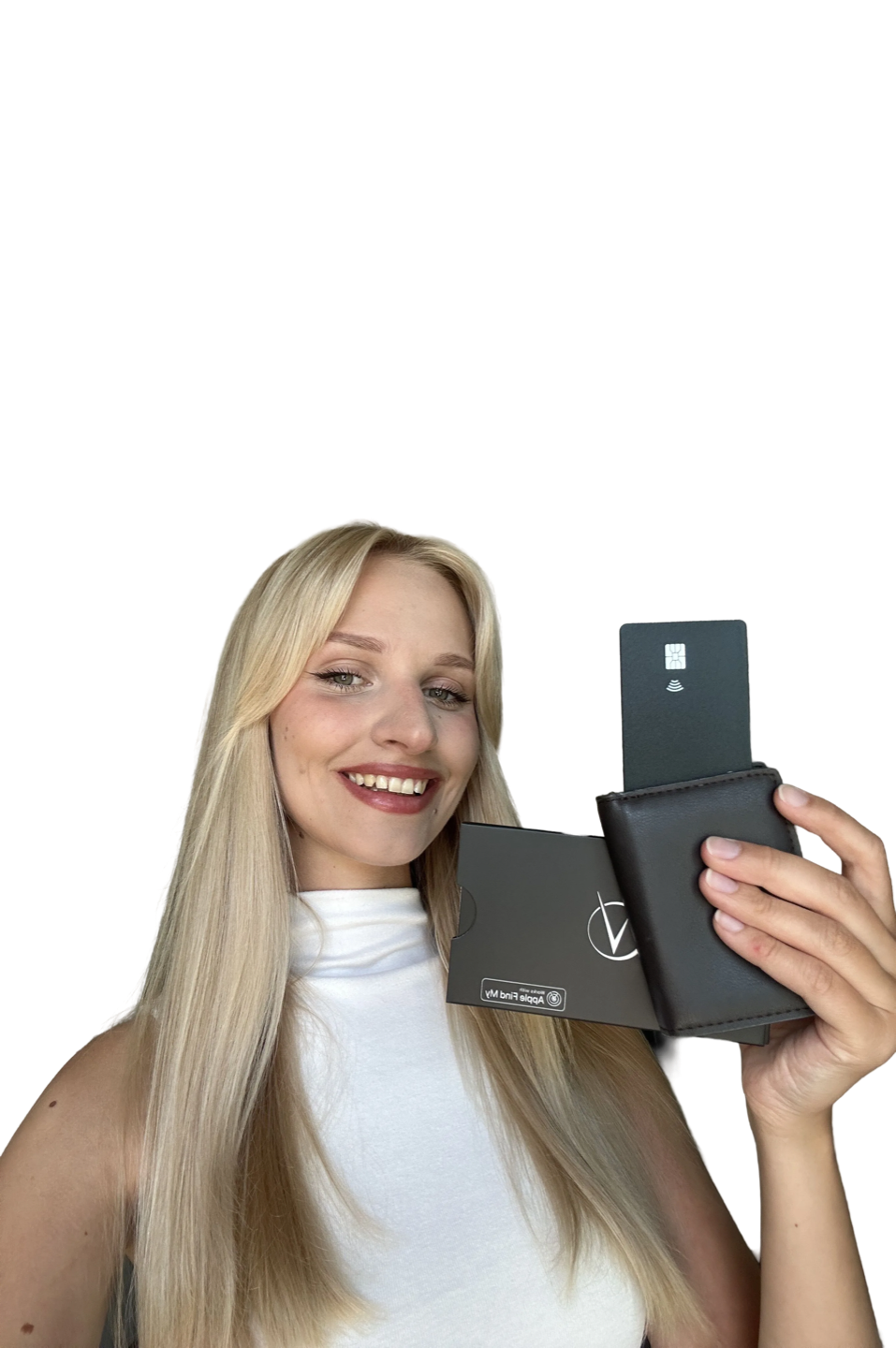 Smiling customer holding the black Vantamo tracker card with its packaging and a wallet