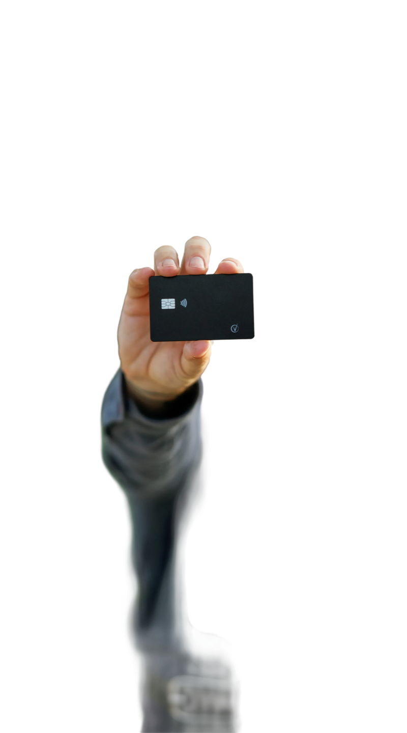 Hand holding the black Vantamo tracker card out toward the camera